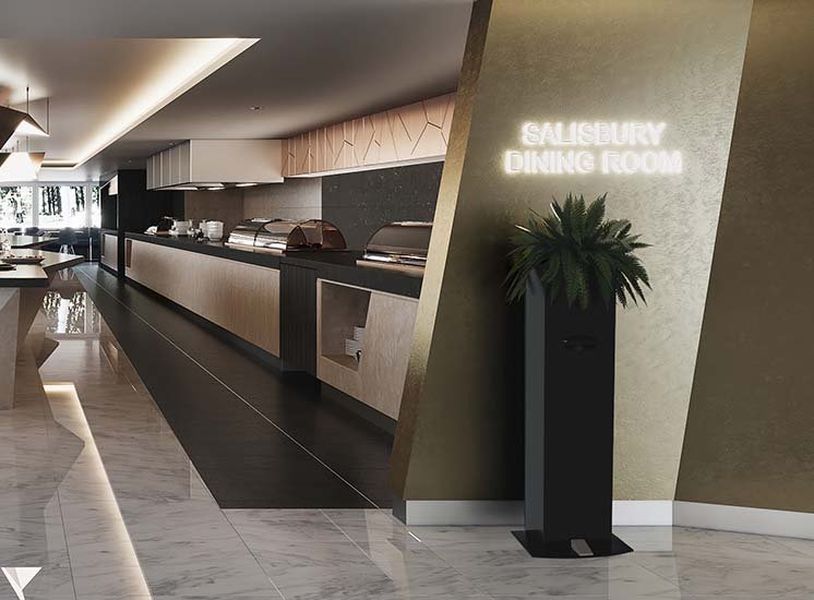 A tall touchless hand sanitiser unit at the entry of a sleek buffet dining space planted with a lush green plant